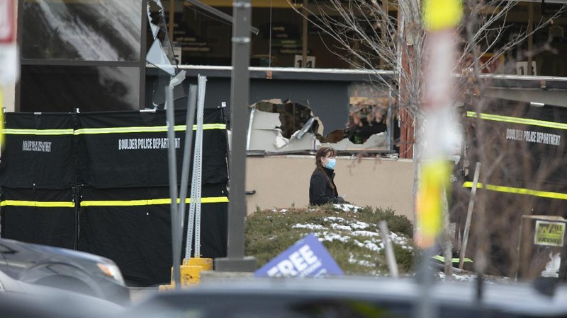Police work on the scene outside of a King Soopers grocery store where a shooting took place Monday, March 22, 2021, in Boulder, Colo. (AP Photo/David Zalubowski)