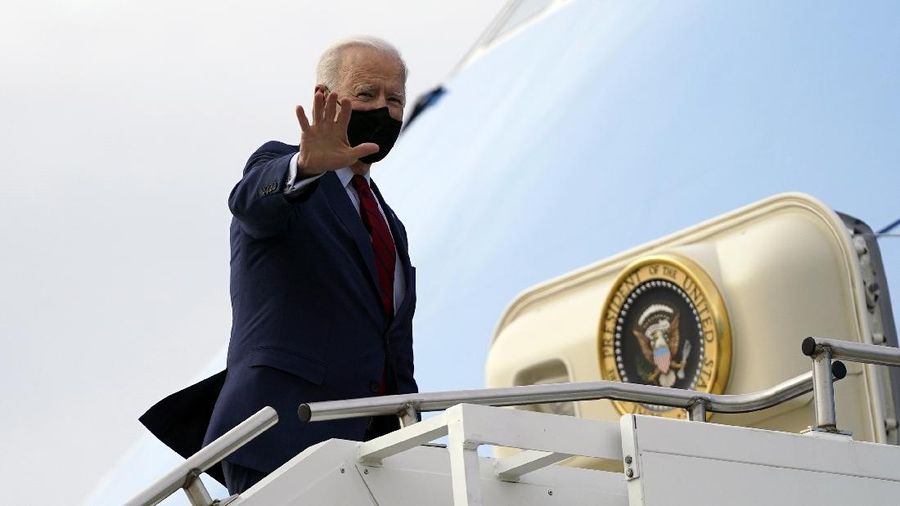 President Joe Biden boards Air Force One on departure from John Glenn Columbus International Airport, Tuesday, March 23, 2021, in Columbus, Ohio. (AP Photo/Evan Vucci)