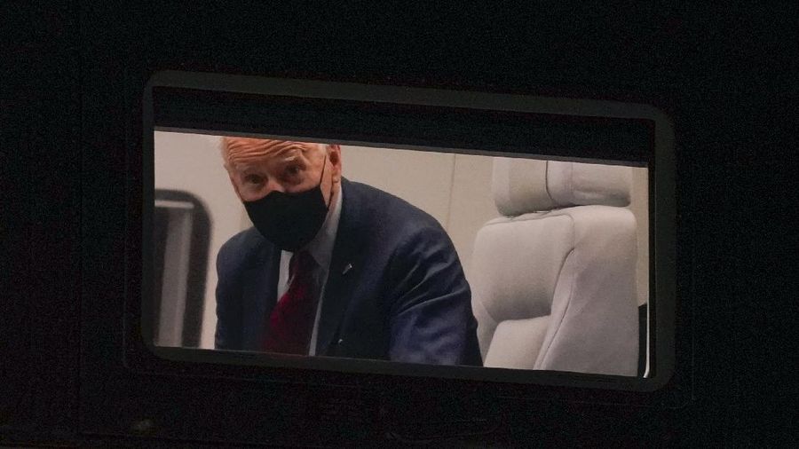 President Joe Biden looks out from his window on Marine One as it approaches the South Lawn of the White House in Washington, Tuesday, March 23, 2021. Biden is returning from Columbus, Ohio. (AP Photo/Patrick Semansky)