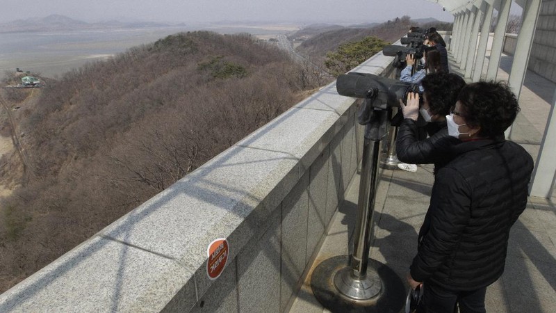 Military guard posts of North Korea, rear, and South Korea, bottom, are seen in Paju, at the border with North Korea, South Korea, Wednesday, March 24, 2021. North Korea fired short-range missiles this past weekend, just days after the sister of Kim Jong Un threatened the United States and South Korea for holding joint military exercises. (AP Photo/Ahn Young-joon)