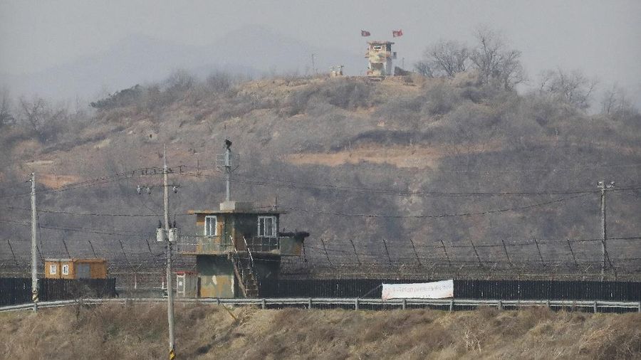 Military guard posts of North Korea, rear, and South Korea, bottom, are seen in Paju, at the border with North Korea, South Korea, Wednesday, March 24, 2021. North Korea fired short-range missiles this past weekend, just days after the sister of Kim Jong Un threatened the United States and South Korea for holding joint military exercises. (AP Photo/Ahn Young-joon)
