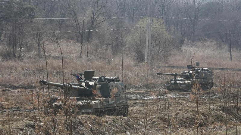 Military guard posts of North Korea, rear, and South Korea, bottom, are seen in Paju, at the border with North Korea, South Korea, Wednesday, March 24, 2021. North Korea fired short-range missiles this past weekend, just days after the sister of Kim Jong Un threatened the United States and South Korea for holding joint military exercises. (AP Photo/Ahn Young-joon)