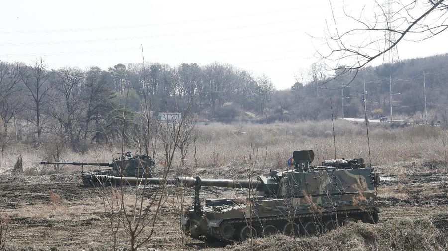 Military guard posts of North Korea, rear, and South Korea, bottom, are seen in Paju, at the border with North Korea, South Korea, Wednesday, March 24, 2021. North Korea fired short-range missiles this past weekend, just days after the sister of Kim Jong Un threatened the United States and South Korea for holding joint military exercises. (AP Photo/Ahn Young-joon)