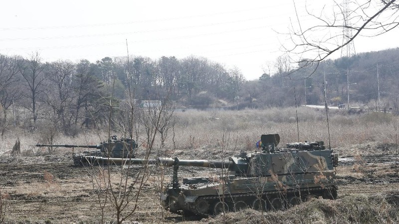 Military guard posts of North Korea, rear, and South Korea, bottom, are seen in Paju, at the border with North Korea, South Korea, Wednesday, March 24, 2021. North Korea fired short-range missiles this past weekend, just days after the sister of Kim Jong Un threatened the United States and South Korea for holding joint military exercises. (AP Photo/Ahn Young-joon)