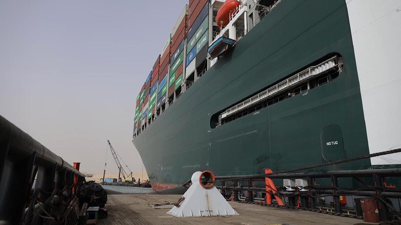 This photo released by the Suez Canal Authority on Thursday, March 25, 2021, shows the Ever Given, a Panama-flagged cargo ship, after it become wedged across the Suez Canal and blocking traffic in the vital waterway. An operation is underway to try to work free the ship wedged across Egypt's Suez Canal, which further imperiled global shipping Thursday as at least 150 other vessels needing to pass through the crucial waterway idled waiting for the obstruction to clear. (Suez Canal Authority via AP)