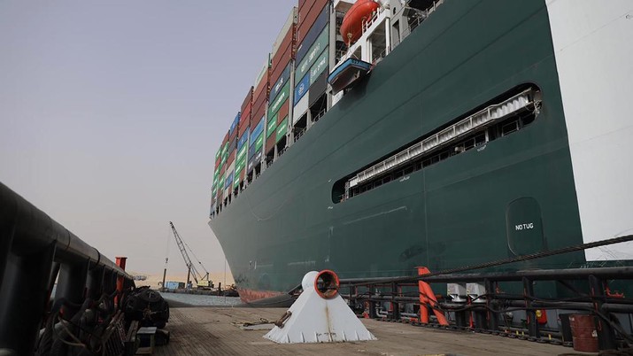 Egypt Suez Canal This photo released by the Suez Canal Authority on Thursday, March 25, 2021, shows the Ever Given, a Panama-flagged cargo ship, after it become wedged across the Suez Canal and blocking traffic in the vital waterway, seen from another vessel. An operation is underway to try to work free the ship, which further imperiled global shipping Thursday as at least 150 other vessels needing to pass through the crucial waterway idled waiting for the obstruction to clear. (Suez Canal Authority via AP)