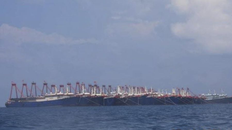 In this photo provided Sunday, March 21, 2021, by the Philippine Coast Guard/National Task Force-West Philippine Sea, some of the 220 Chinese vessels are seen moored at Whitsun Reef, South China Sea on March 7, 2021. The Philippine government expressed concern after spotting more than 200 Chinese fishing vessels it believed were crewed by militias at a reef claimed by both countries in the South China Sea, but it did not immediately lodge a protest. (Philippine Coast Guard/National Task Force-West Philippine Sea via AP)