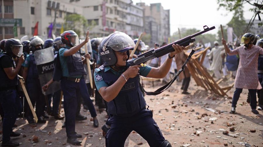 A group of protestors pelt stones on another after Friday prayers at Baitul Mokarram mosque in Dhaka, Bangladesh, Friday, March 26, 2021. Witnesses said violent clashes broke out after one faction of protesters began waving their shoes as a sign of disrespect to Indian Prime Minister Narendra Modi, and another group tried to stop them. Local media said the protesters who tried to stop the shoe-waving are aligned with the ruling Awami League party. The party criticized the other protest faction for attempting to create chaos in the country during Modi’s visit. (AP Photo/Mahmud Hossain Opu)