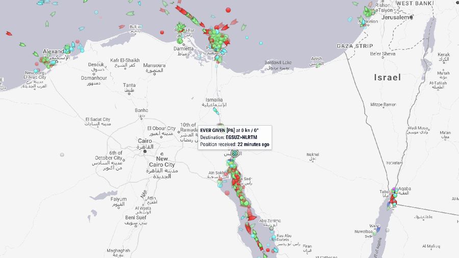 Ever Given, a Panama-flagged cargo ship that is wedged across the Suez Canal and blocking traffic in the vital waterway is seen Sunday, March 28, 2021. The massive Ever Given, a Panama-flagged, Japanese-owned ship that carries cargo between Asia and Europe, got stuck Tuesday in a single-lane stretch of the canal. In the time since, authorities have been unable to remove the vessel and traffic through the canal has been halted,(AP Photo/Mohamed Elshahed)