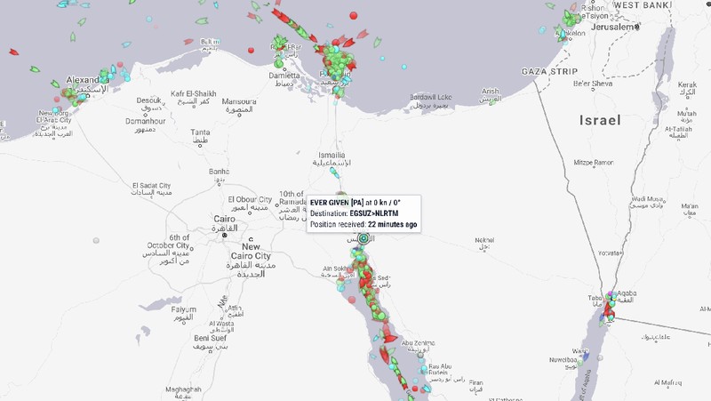 Ever Given, a Panama-flagged cargo ship that is wedged across the Suez Canal and blocking traffic in the vital waterway is seen Sunday, March 28, 2021. The massive Ever Given, a Panama-flagged, Japanese-owned ship that carries cargo between Asia and Europe, got stuck Tuesday in a single-lane stretch of the canal. In the time since, authorities have been unable to remove the vessel and traffic through the canal has been halted,(AP Photo/Mohamed Elshahed)