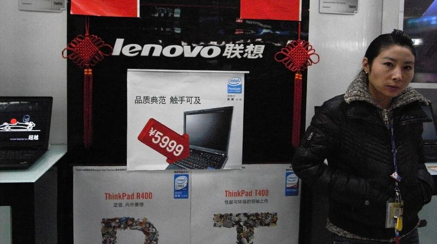 FILE - In this Jan. 8, 2009 file photo, a vendor waits for customers at a computer shop selling Lenovo laptops in Beijing, China. Chinese personal computer maker Lenovo said Thursday Feb. 17, 2011, its quarterly profit rose 25 percent on double-digit sales growth in developing markets. (AP Photo/Ng Han Guan, File)