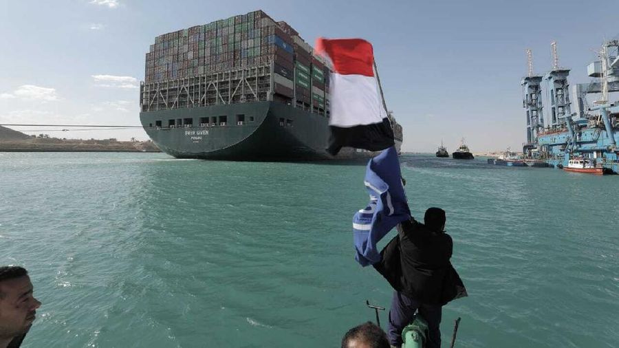In this photo released by Suez Canal Authority, the Ever Given, a Panama-flagged cargo ship is accompanied by Suez Canal tugboats as it moves in the Suez Canal, Egypt, Monday, March 29, 2021. Salvage teams on Monday set free a colossal container ship that has halted global trade through the Suez Canal, bringing an end to a crisis that for nearly a week had clogged one of the world’s most vital maritime arteries. (Suez Canal Authority via AP)