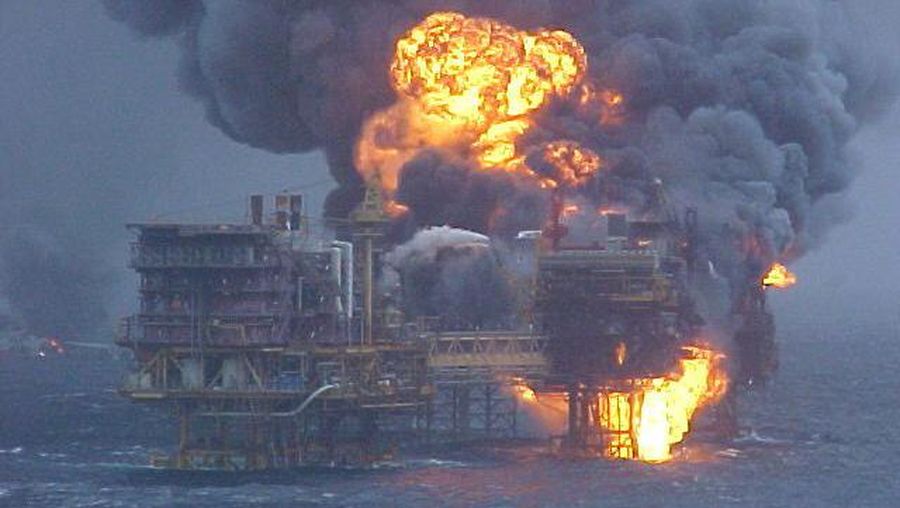Smoke pours from the remains of the Piper Alpha Oil platform in the North Sea off the coast of Scotland, Friday July 8, 1988. 160 oil rig workers were killed Wednesday night when a massive explosion and fire ripped through the platform. (AP Photo/Dave Cauklin)
