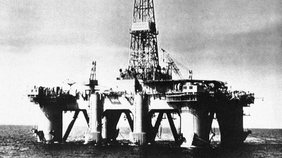 Smoke pours from the remains of the Piper Alpha Oil platform in the North Sea off the coast of Scotland, Friday July 8, 1988. 160 oil rig workers were killed Wednesday night when a massive explosion and fire ripped through the platform. (AP Photo/Dave Cauklin)