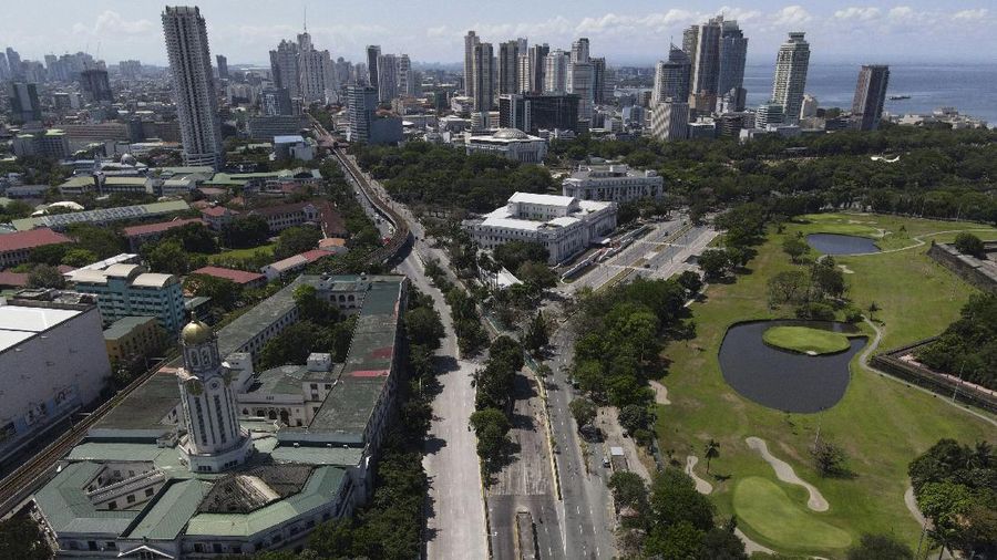An almost empty Welcome Rotonda roundabout is seen as the government implements a strict lockdown to prevent the spread of the coronavirus on Good Friday, April 2, 2021 in Manila, Philippines. Filipinos marked Jesus Christ's crucifixion Friday in one of the most solemn holidays in Asia's largest Catholic nation which combined with a weeklong coronavirus lockdown to empty Manila's streets of crowds and heavy traffic jams. Major highways and roads were eerily quiet on Good Friday and churches were deserted too after religious gatherings were prohibited in metropolitan Manila and four outlying provinces. (AP Photo/Aaron Favila)