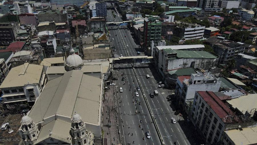 An almost empty Welcome Rotonda roundabout is seen as the government implements a strict lockdown to prevent the spread of the coronavirus on Good Friday, April 2, 2021 in Manila, Philippines. Filipinos marked Jesus Christ's crucifixion Friday in one of the most solemn holidays in Asia's largest Catholic nation which combined with a weeklong coronavirus lockdown to empty Manila's streets of crowds and heavy traffic jams. Major highways and roads were eerily quiet on Good Friday and churches were deserted too after religious gatherings were prohibited in metropolitan Manila and four outlying provinces. (AP Photo/Aaron Favila)