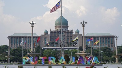A Malaysian national flag is on display in front of the prime minister's office building in Putrajaya, Malaysia Friday, March 20, 2020. Malaysian government issued a movement order to the public starting from March 18 until March 31 to block the spread of the new coronavirus. For most people the new coronavirus causes only mild or moderate symptoms, but for some it can cause more severe illness. (AP Photo/Vincent Thian)