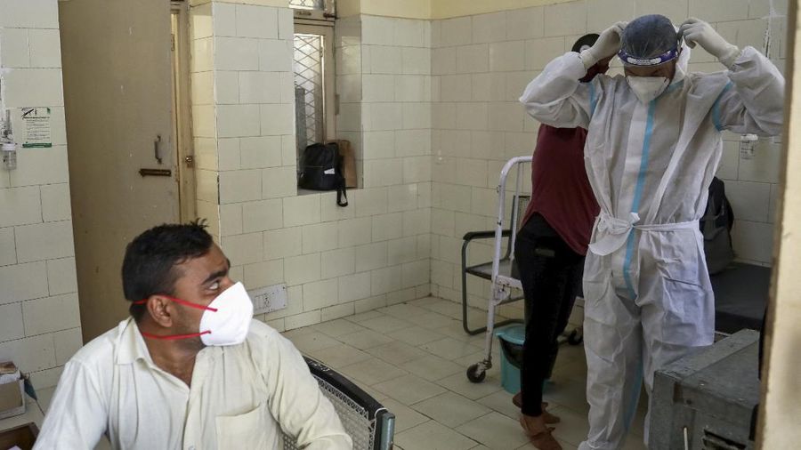 People wait to get inoculated in New Delhi, India, Monday, April 5, 2021. India’s daily confirmed coronavirus cases have recorded the biggest single-day spike since the pandemic began, indicating a renewed crush of infections. The government has intensified its vaccination drive in recent weeks, now administering over 3 million jabs a day. (AP Photo/Manish Swarup)
