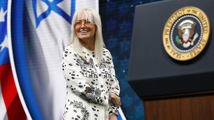 Miriam Adelson Miriam Adelson, wife of Las Vegas Sands Corporation Chief Executive and Republican mega donor Sheldon Adelson, stands onstage before introducing President Donald Trump at the Israeli American Council National Summit in Hollywood, Fla., Saturday, Dec. 7, 2019. (AP Photo/Patrick Semansky)