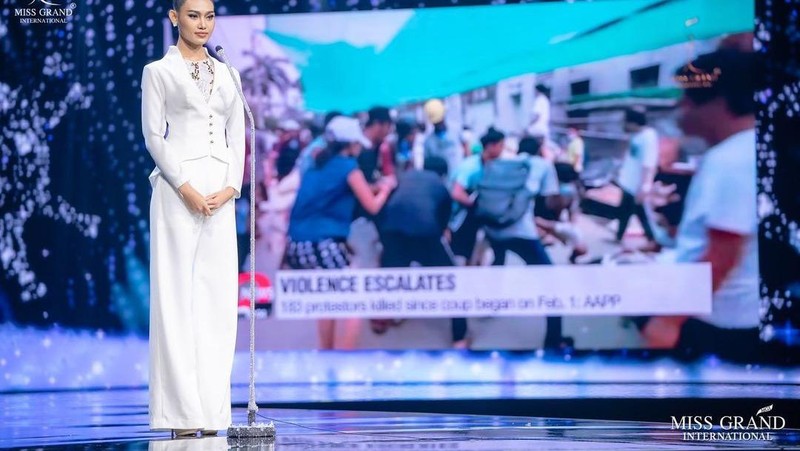 In this photo provided by Miss Grand International, Miss Myanmar, Han Lay, speaks on stage during Miss Grand International contest Saturday, March 27, 2021, in Bangkok, Thailand. The beauty pageant contestant from Myanmar used her brief moment in the spotlight on Saturday night to appeal for international help for her country, on the worst day for bloodshed since the military there staged its coup almost two months ago.(Miss Grand International via AP)
