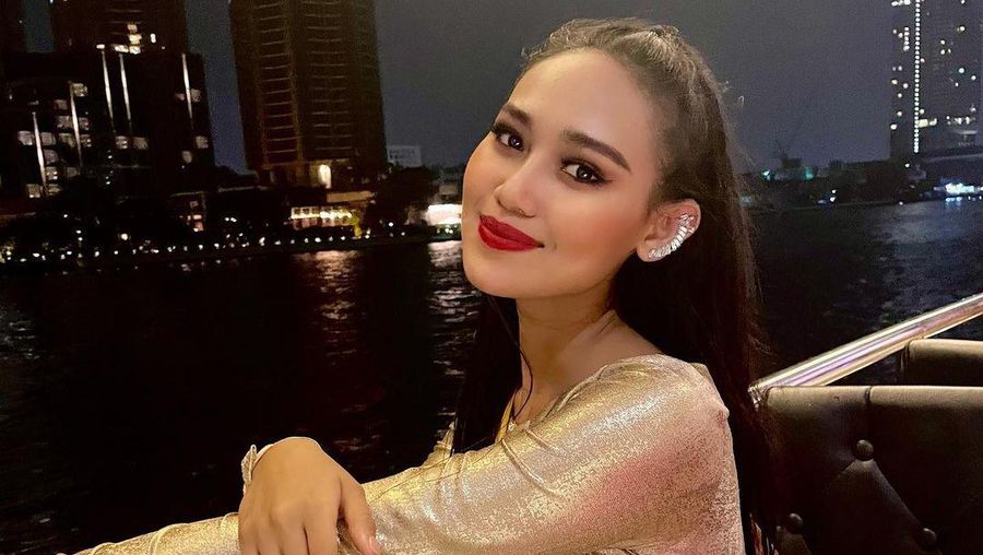 In this photo provided by Miss Grand International, Miss Myanmar, Han Lay, speaks on stage during Miss Grand International contest Saturday, March 27, 2021, in Bangkok, Thailand. The beauty pageant contestant from Myanmar used her brief moment in the spotlight on Saturday night to appeal for international help for her country, on the worst day for bloodshed since the military there staged its coup almost two months ago.(Miss Grand International via AP)