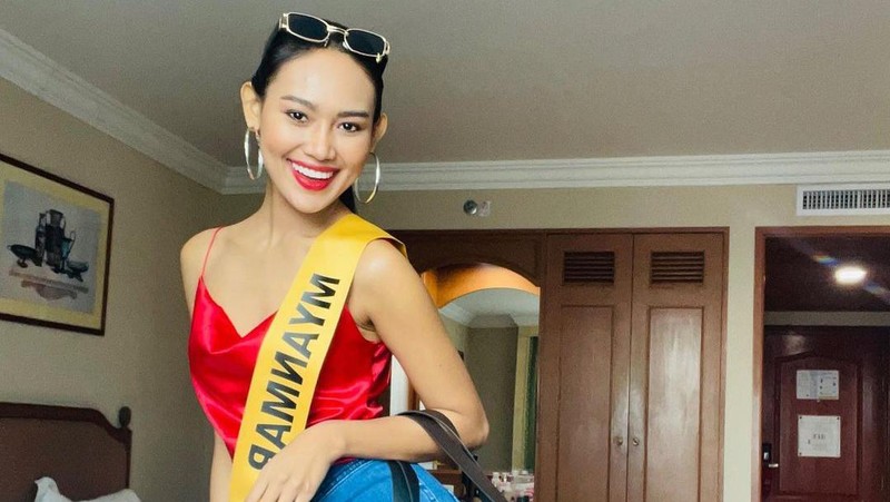 In this photo provided by Miss Grand International, Miss Myanmar, Han Lay, speaks on stage during Miss Grand International contest Saturday, March 27, 2021, in Bangkok, Thailand. The beauty pageant contestant from Myanmar used her brief moment in the spotlight on Saturday night to appeal for international help for her country, on the worst day for bloodshed since the military there staged its coup almost two months ago.(Miss Grand International via AP)