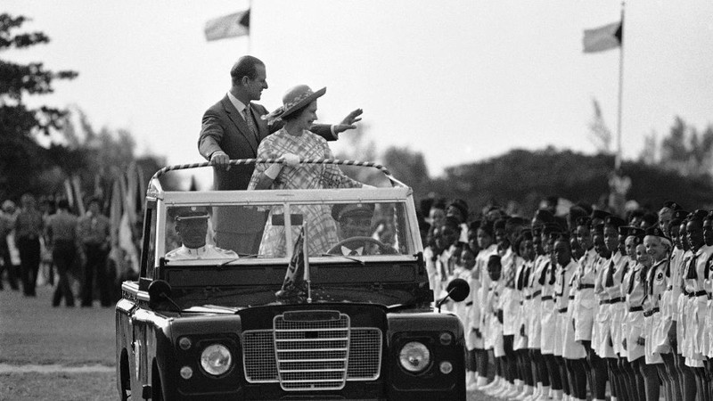 FILE - In this July 31, 1947 file photo, Lieut. Philip Mountbatten, as he was then called, center, inspects his men at the Petty Officers' Training Center at Corsham, England. There certainly won't be fuss. Count on that. When Britain's Prince Philip reaches the grand age of 99 on Wednesday, he will spend it quietly and in much the same way he's spent most of his adult life: beside Queen Elizabeth II. Prince Philip was born into the Greek royal family but spent almost all of his life as a pillar of the British one. His path was forged when he married the heir to the British throne, and a promising naval career was cut short when his wife suddenly became Queen Elizabeth II. Nevertheless, he set about forging a place for himself as royal consort. He was a patron of charities and a supporter of projects for young people. He was married for more than 73 years and was still carrying out royal engagements into his late 90s. (AP Photo/File)