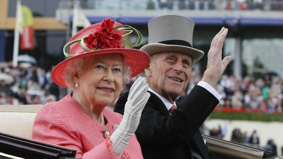 FILE - In this Thursday June, 16, 2011 file photo Britain's Queen Elizabeth II with Prince Philip arrive by horse drawn carriage in the parade ring on the third day, traditionally known as Ladies Day, of the Royal Ascot horse race meeting at Ascot, England. Buckingham Palace says Prince Philip, husband of Queen Elizabeth II, has died aged 99. (AP Photo/Alastair Grant, File)