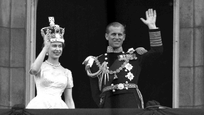 FILE - In this July 31, 1947 file photo, Lieut. Philip Mountbatten, as he was then called, center, inspects his men at the Petty Officers' Training Center at Corsham, England. There certainly won't be fuss. Count on that. When Britain's Prince Philip reaches the grand age of 99 on Wednesday, he will spend it quietly and in much the same way he's spent most of his adult life: beside Queen Elizabeth II. Prince Philip was born into the Greek royal family but spent almost all of his life as a pillar of the British one. His path was forged when he married the heir to the British throne, and a promising naval career was cut short when his wife suddenly became Queen Elizabeth II. Nevertheless, he set about forging a place for himself as royal consort. He was a patron of charities and a supporter of projects for young people. He was married for more than 73 years and was still carrying out royal engagements into his late 90s. (AP Photo/File)
