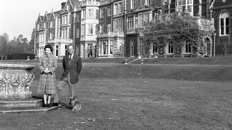 FILE - In this July 31, 1947 file photo, Lieut. Philip Mountbatten, as he was then called, center, inspects his men at the Petty Officers' Training Center at Corsham, England. There certainly won't be fuss. Count on that. When Britain's Prince Philip reaches the grand age of 99 on Wednesday, he will spend it quietly and in much the same way he's spent most of his adult life: beside Queen Elizabeth II. Prince Philip was born into the Greek royal family but spent almost all of his life as a pillar of the British one. His path was forged when he married the heir to the British throne, and a promising naval career was cut short when his wife suddenly became Queen Elizabeth II. Nevertheless, he set about forging a place for himself as royal consort. He was a patron of charities and a supporter of projects for young people. He was married for more than 73 years and was still carrying out royal engagements into his late 90s. (AP Photo/File)