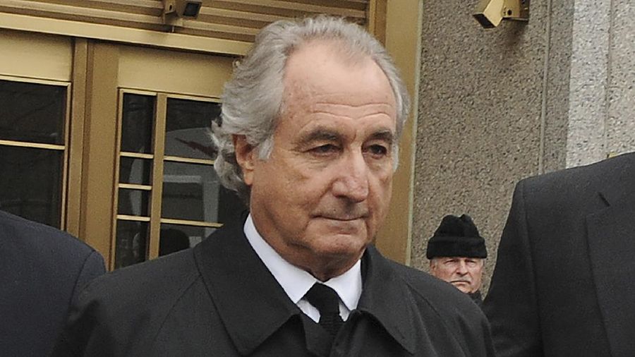 FILE - Bernard Madoff exits Manhattan federal court, Tuesday, March 10, 2009, in New York. Madoff, the financier who pleaded guilty to orchestrating the largest Ponzi scheme in history, died early Wednesday, April 14, 2021,  in a federal prison, a person familiar with the matter told The Associated Press. (AP Photo/ Louis Lanzano, File)
