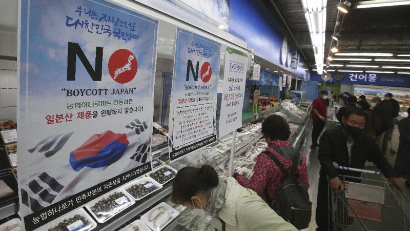 A notice denouncing the Japanese government's decision on releasing treated radioactive Fukushima water hangs at the seafood section of a grocery store in Seoul, South Korea, Friday, April 16, 2021. Japan's government announced Tuesday it would start releasing treated radioactive water from the wrecked Fukushima nuclear plant into the Pacific Ocean in two years. It's a move that's fiercely opposed by fishermen, residents and Japan's neighbors. The signs read: 