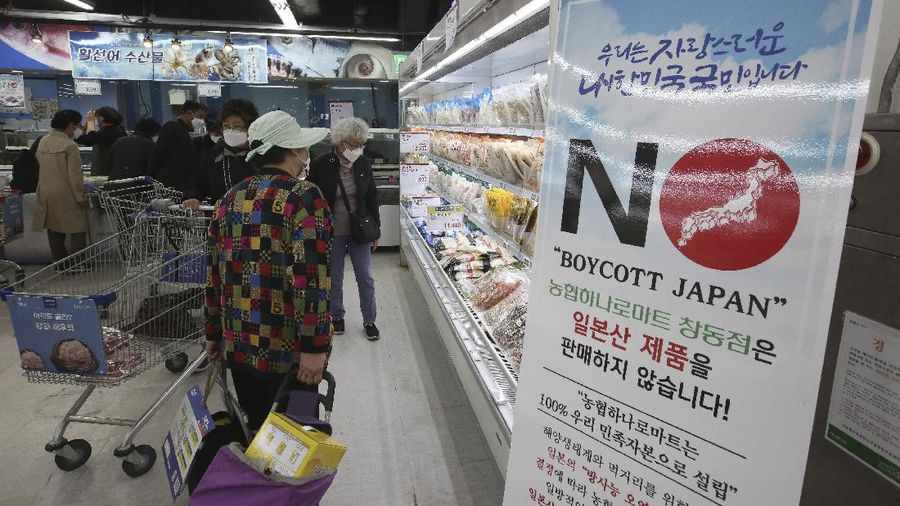 A notice denouncing the Japanese government's decision on releasing treated radioactive Fukushima water hangs at the seafood section of a grocery store in Seoul, South Korea, Friday, April 16, 2021. Japan's government announced Tuesday it would start releasing treated radioactive water from the wrecked Fukushima nuclear plant into the Pacific Ocean in two years. It's a move that's fiercely opposed by fishermen, residents and Japan's neighbors. The signs read: 