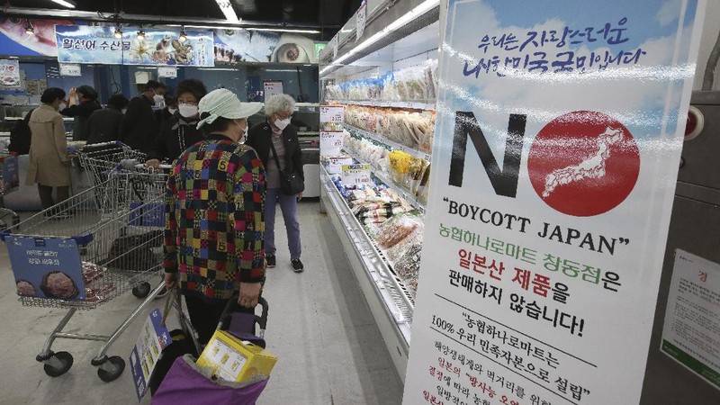 A notice denouncing the Japanese government's decision on releasing treated radioactive Fukushima water hangs at the seafood section of a grocery store in Seoul, South Korea, Friday, April 16, 2021. Japan's government announced Tuesday it would start releasing treated radioactive water from the wrecked Fukushima nuclear plant into the Pacific Ocean in two years. It's a move that's fiercely opposed by fishermen, residents and Japan's neighbors. The signs read: 