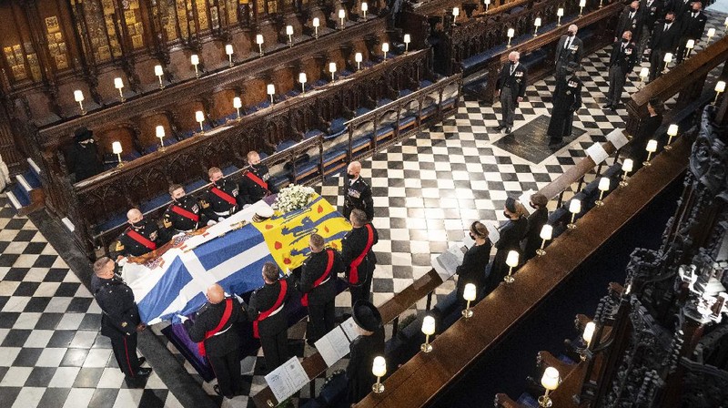 The coffin arrives at St George's Chapel for the funeral of Britain's Prince Philip inside Windsor Castle in Windsor, England, Saturday, April 17, 2021. Prince Philip died April 9 at the age of 99 after 73 years of marriage to Britain's Queen Elizabeth II. (Justin Tallis/Pool via AP)