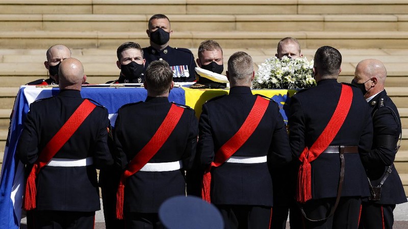 The coffin arrives at St George's Chapel for the funeral of Britain's Prince Philip inside Windsor Castle in Windsor, England, Saturday, April 17, 2021. Prince Philip died April 9 at the age of 99 after 73 years of marriage to Britain's Queen Elizabeth II. (Justin Tallis/Pool via AP)