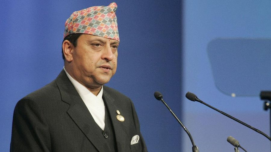 King of Nepal Bir Bikram Shah Gyanendra, speaks to the assembly during a plenary session of the World Summit on the Information Society at the convention center in Kram, 10 kms (6 miles) north of Tunis, Tunisia, Wednesday Nov. 16, 2005. Negotiators from more than 100 countries agreed late Tuesday to leave the United States in charge of the Internet's addressing system, averting a U.S.- EU showdown at this week's U.N. technology summit. (AP Photo / Michel Euler)