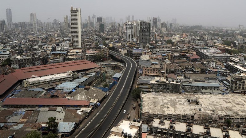 A street is seen deserted during weekend lockdown in Mumbai, India, Saturday, April 10, 2021. India has been overwhelmed by hundreds of thousands of new coronavirus cases daily, bringing pain, fear and agony to many lives as lockdowns have been placed in Delhi and other cities around the country. (AP Photo/Rajanish Kakade)