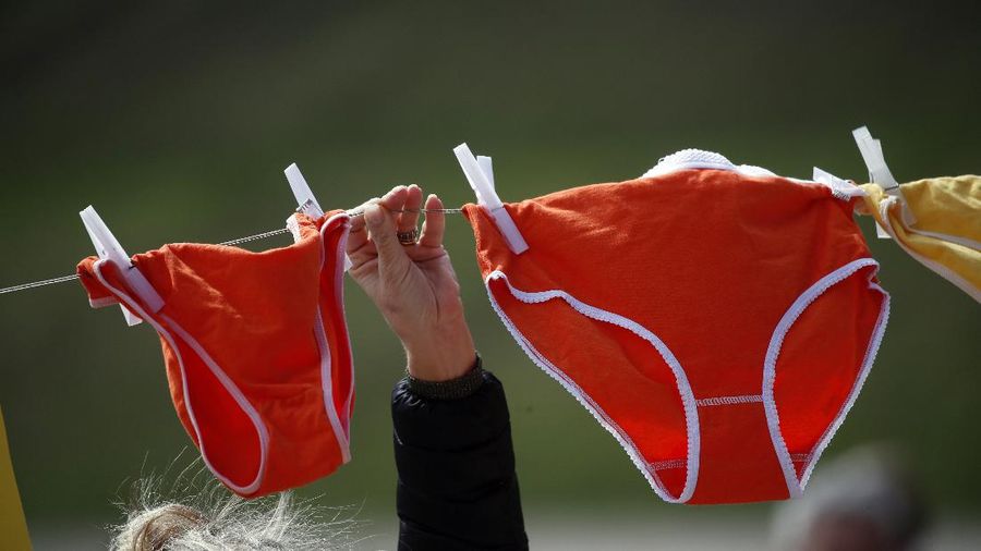 Restaurant owners hang coloured underwear during a protest against restriction measures to curb the spread of COVID-19, in Rome, Tuesday, April 13, 2021. Angry restaurant and other owners of shuttered establishments have been protesting in Rome as frustration builds in business sectors over weeks of current pandemic lockdown measures. (AP Photo/Alessandra Tarantino)