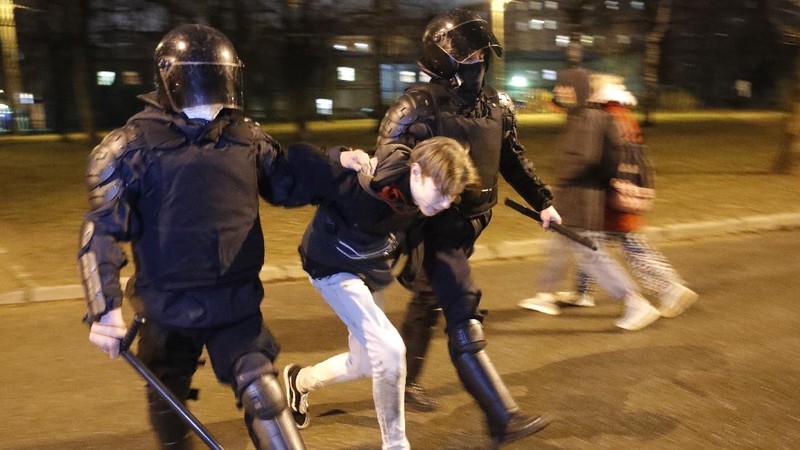 A woman argues with police officer during a protest in support of jailed opposition leader Alexei Navalny in Ulan-Ude, the regional capital of Buryatia, a region near the Russia-Mongolia border, Russia, Wednesday, April 21, 2021. Navalny's team has called for nationwide protests on Wednesday following reports that the politician's health was deteriorating in prison, where he has been on hunger strike since March 31. Russian authorities have stressed that the demonstrations were not authorized and warned against participating in them. (AP Photo/Anna Ogorodnik)