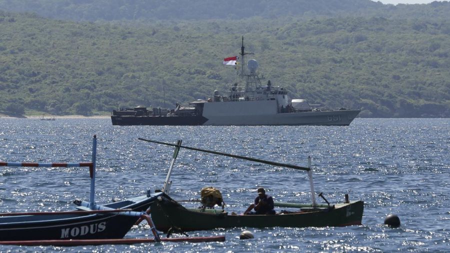 Indonesian Navy ship KRI Singa sails to take part in the search for submarine KRI Nanggala that went missing while participating in a training exercise on Wednesday, off Banyuwangi, East Java, Indonesia, Thursday, April 22, 2021. Indonesia's navy ships are intensely searching the waters where one of its submarines was last detected before it disappeared, as neighboring countries are set to join the complex operation. (AP Photo)