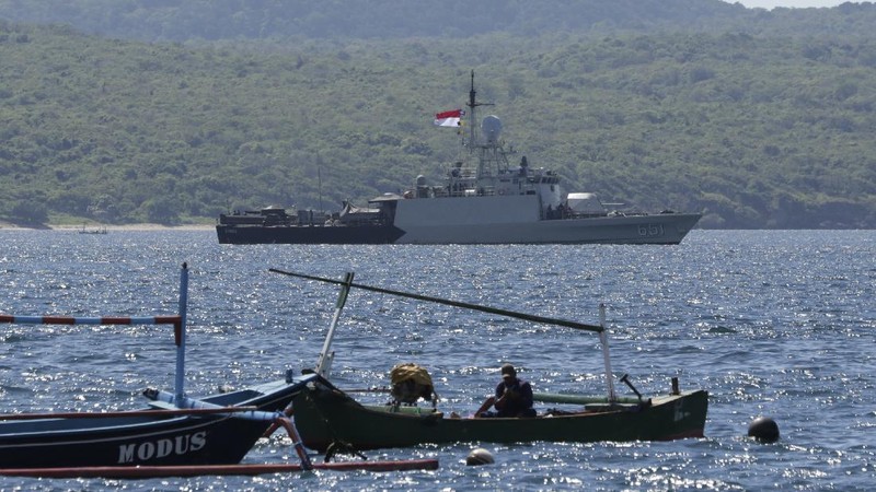 Indonesian Navy ship KRI Singa sails to take part in the search for submarine KRI Nanggala that went missing while participating in a training exercise on Wednesday, off Banyuwangi, East Java, Indonesia, Thursday, April 22, 2021. Indonesia's navy ships are intensely searching the waters where one of its submarines was last detected before it disappeared, as neighboring countries are set to join the complex operation. (AP Photo)