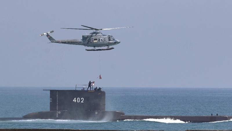 Indonesian Navy submarine KRI Nanggala sails in the waters off Tuban, East Java, Indonesia, as seen in this aerial photo taken from Indonesian Navy helicopter of 400 Air Squadron, in this Monday, Oct. 6, 2014 photo. Indonesia's navy is searching for the submarine that went missing north of the resort island of Bali with a number of people on board, the military said Wednesday. (AP Photo/Eric Ireng)