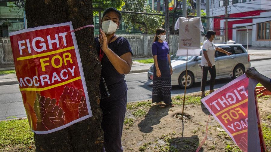 An anti-coup protester flashes the three-finger salute during a demonstration at Yangon, Myanmar on Wednesday, April 21, 2021. Aid workers and activists are warning Myanmar's political upheavals risk causing a regional refugee crisis as the strife following a February coup displaces growing numbers of people who have lost their livelihoods. (AP Photo)
