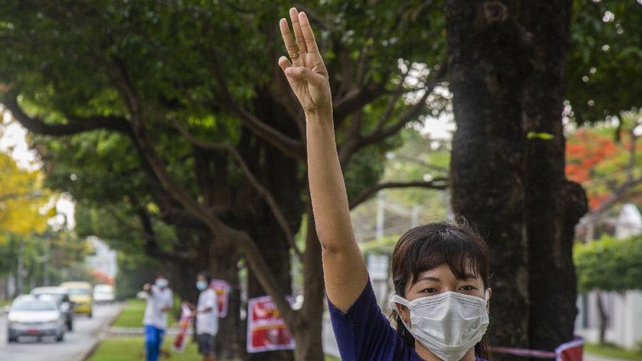 An anti-coup protester flashes the three-finger salute during a demonstration at Yangon, Myanmar on Wednesday, April 21, 2021. Aid workers and activists are warning Myanmar's political upheavals risk causing a regional refugee crisis as the strife following a February coup displaces growing numbers of people who have lost their livelihoods. (AP Photo)
