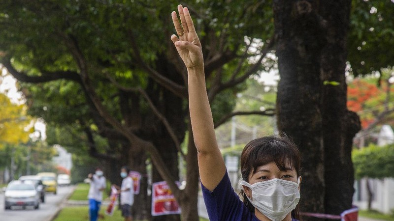 An anti-coup protester flashes the three-finger salute during a demonstration at Yangon, Myanmar on Wednesday, April 21, 2021. Aid workers and activists are warning Myanmar's political upheavals risk causing a regional refugee crisis as the strife following a February coup displaces growing numbers of people who have lost their livelihoods. (AP Photo)