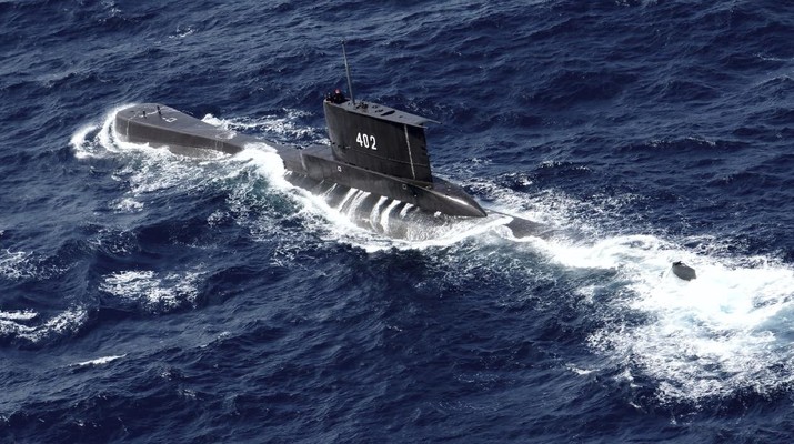 Indonesian Navy submarine KRI Nanggala sails in the waters off Tuban, East Java, Indonesia, as seen in this aerial photo taken from Indonesian Navy helicopter of 400 Air Squadron, in this Monday, Oct. 6, 2014 photo. Indonesia's navy is searching for the submarine that went missing north of the resort island of Bali with a number of people on board, the military said Wednesday. (AP Photo/Eric Ireng)