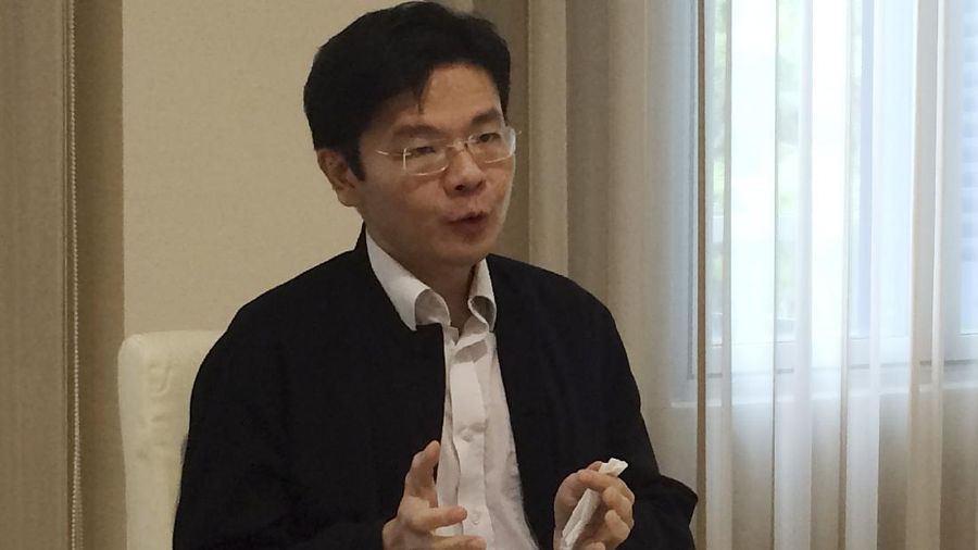 In this May 8, 2015, photo, Lawrence Wong, Singapore's Minister for Culture, Community, and Youth, speaks in Singapore. A government crackdown on a teen video blogger and independent news and opinion website has focused attention on free speech limits, and perhaps the next election, in this cosmopolitan but famously strict city-state. (AP Photo/Ryan Pearson)