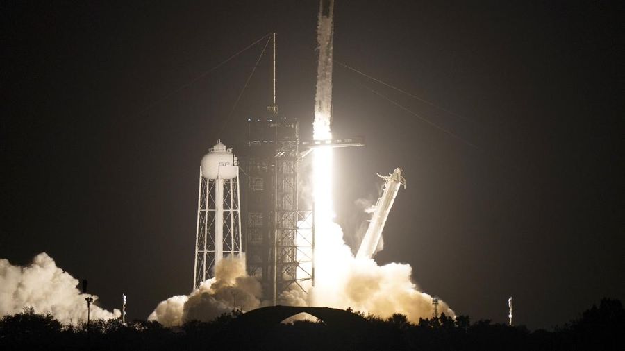 A SpaceX Falcon 9 rocket with the Crew Dragon space capsule lifts off from pad 39A at the Kennedy Space Center in Cape Canaveral, Fla., Friday, April 23, 2021. (AP Photo/Brynn Anderson)
