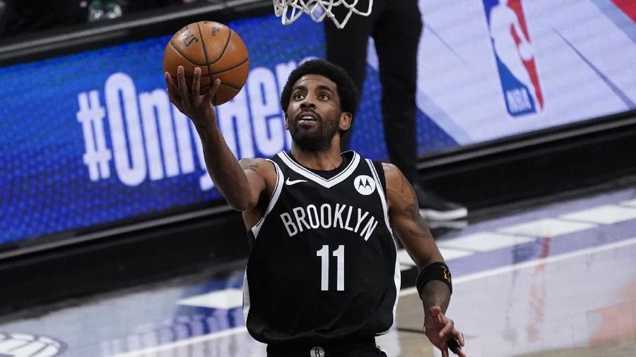 Brooklyn Nets guard Kyrie Irving goes to the basket during the second half of an NBA basketball game against the Boston Celtics, Friday, April 23, 2021, in New York. (AP Photo/Mary Altaffer)